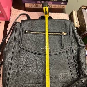 Kate Spade black leather backpack.